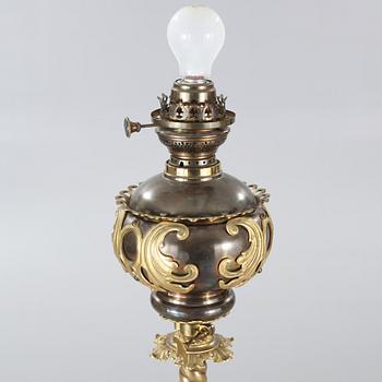 Two floor parafine lamps, 20th century.