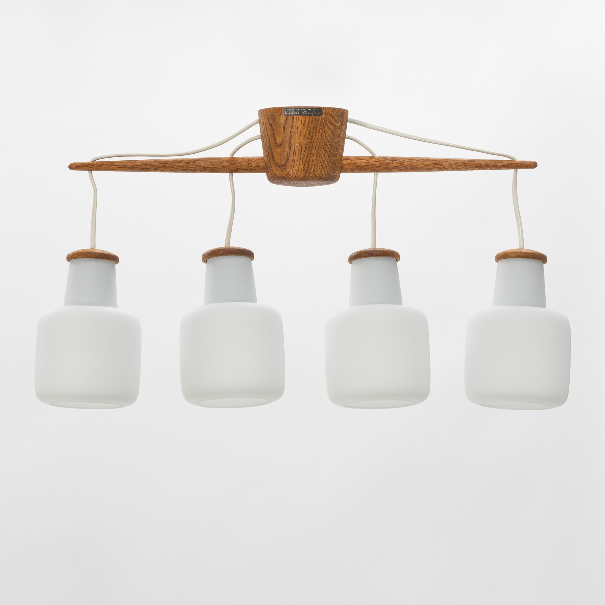 Uno & Östen Kristiansson, an oak and glass ceiling light, Luxus, Vittsjö.