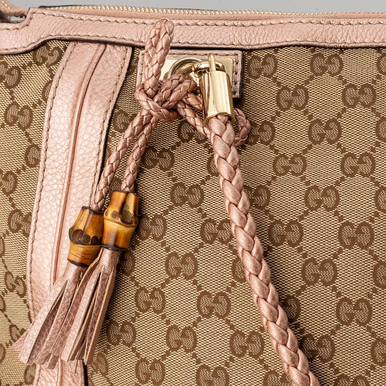 Gucci, a monogram canvas bag.
