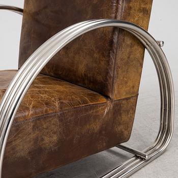A pair of 'Hudson Street' lounge chairs from Ralph Lauren home.