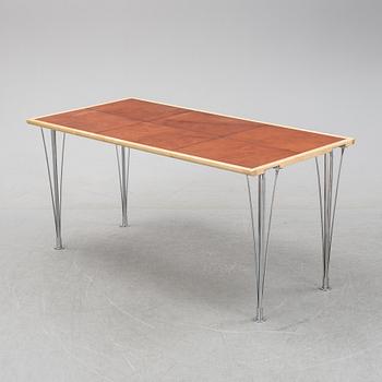 A birch and leather dining table produced by Mathsson International, 21th century.