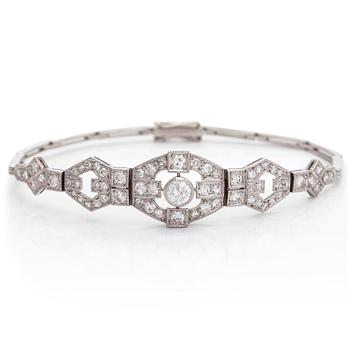 A platinum bracelet, set with brilliant- and single-cut diamonds.