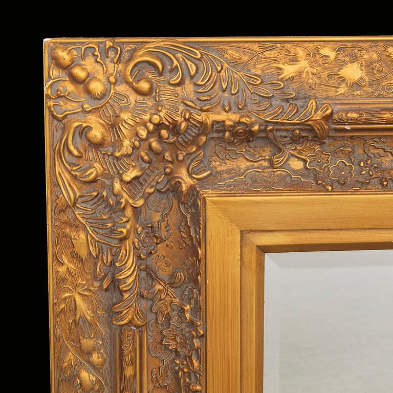 A gilded mirror later part of the 20th century.