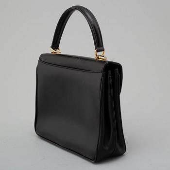 GUCCI, black leather bag.