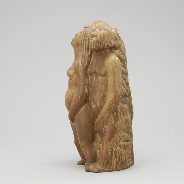 An Åke Holm stoneware figure a woman and two men, Höganäs, 1950's.