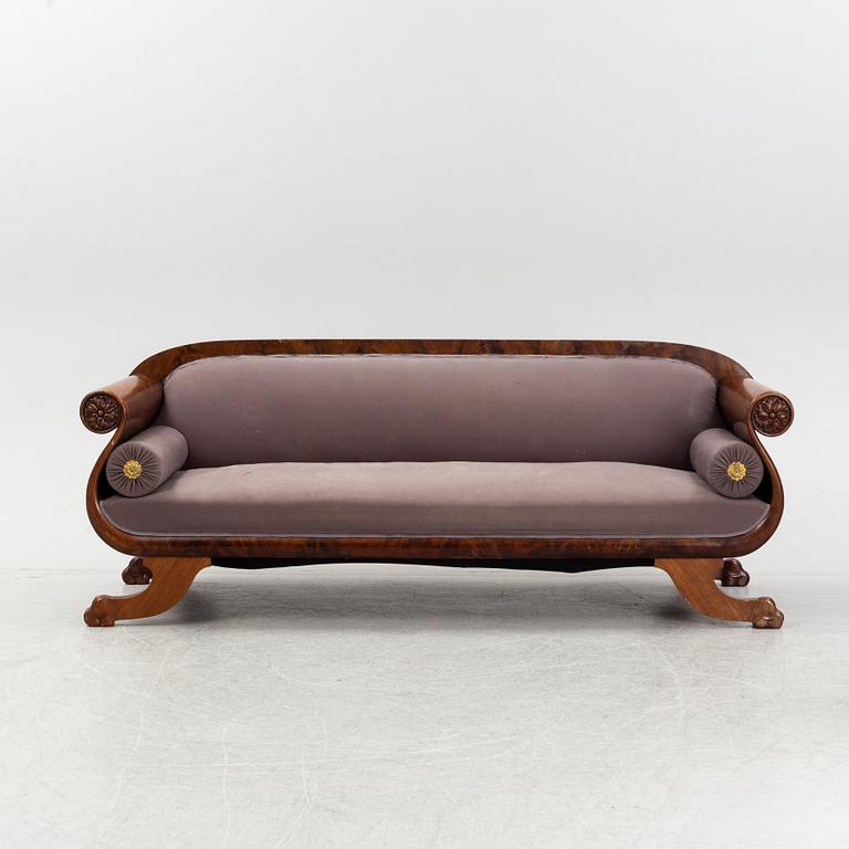 An Empire sofa, first part of the 19th Century.