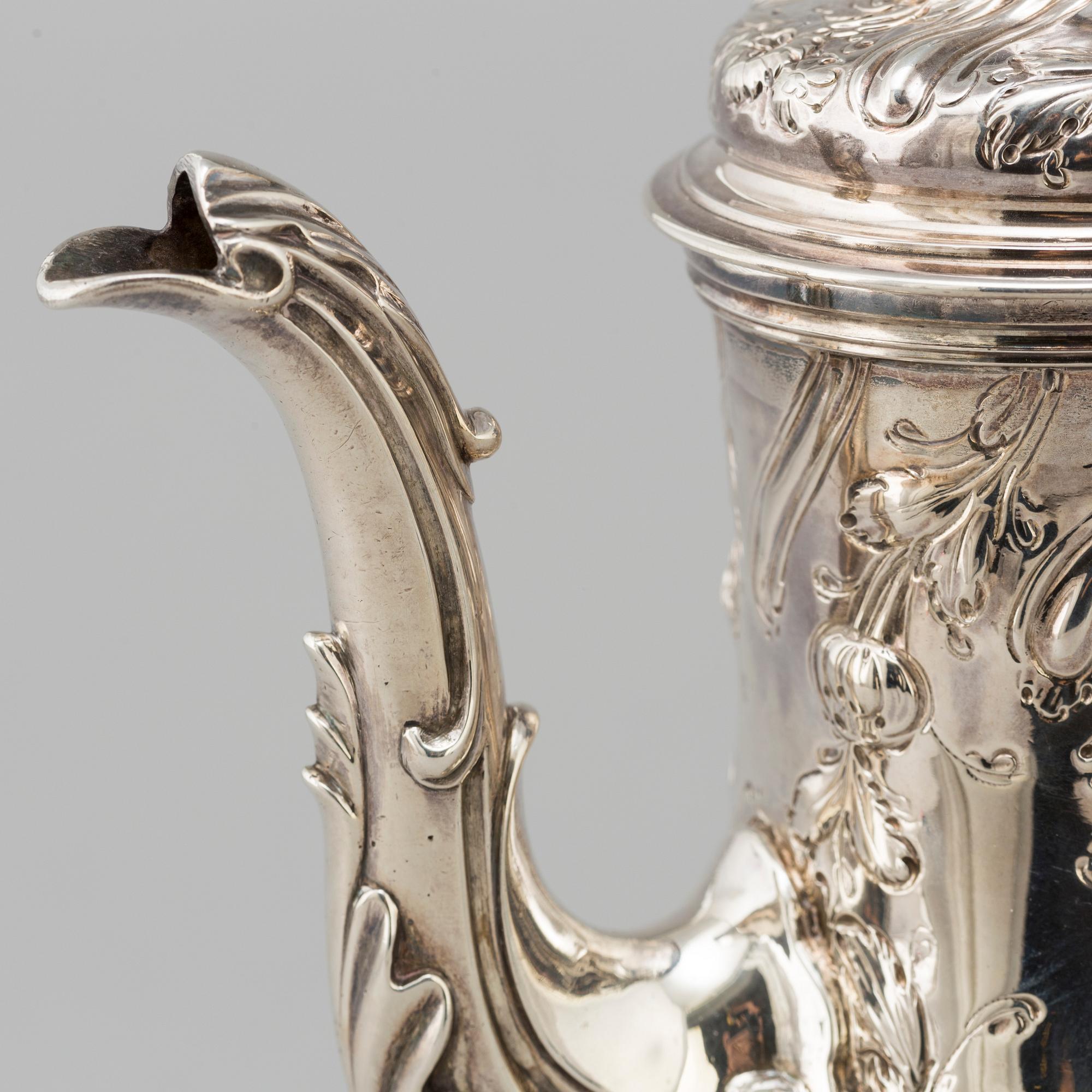 An English 18 th century silver coffee-pot, mark of Benjamin Gignac, London 1763.