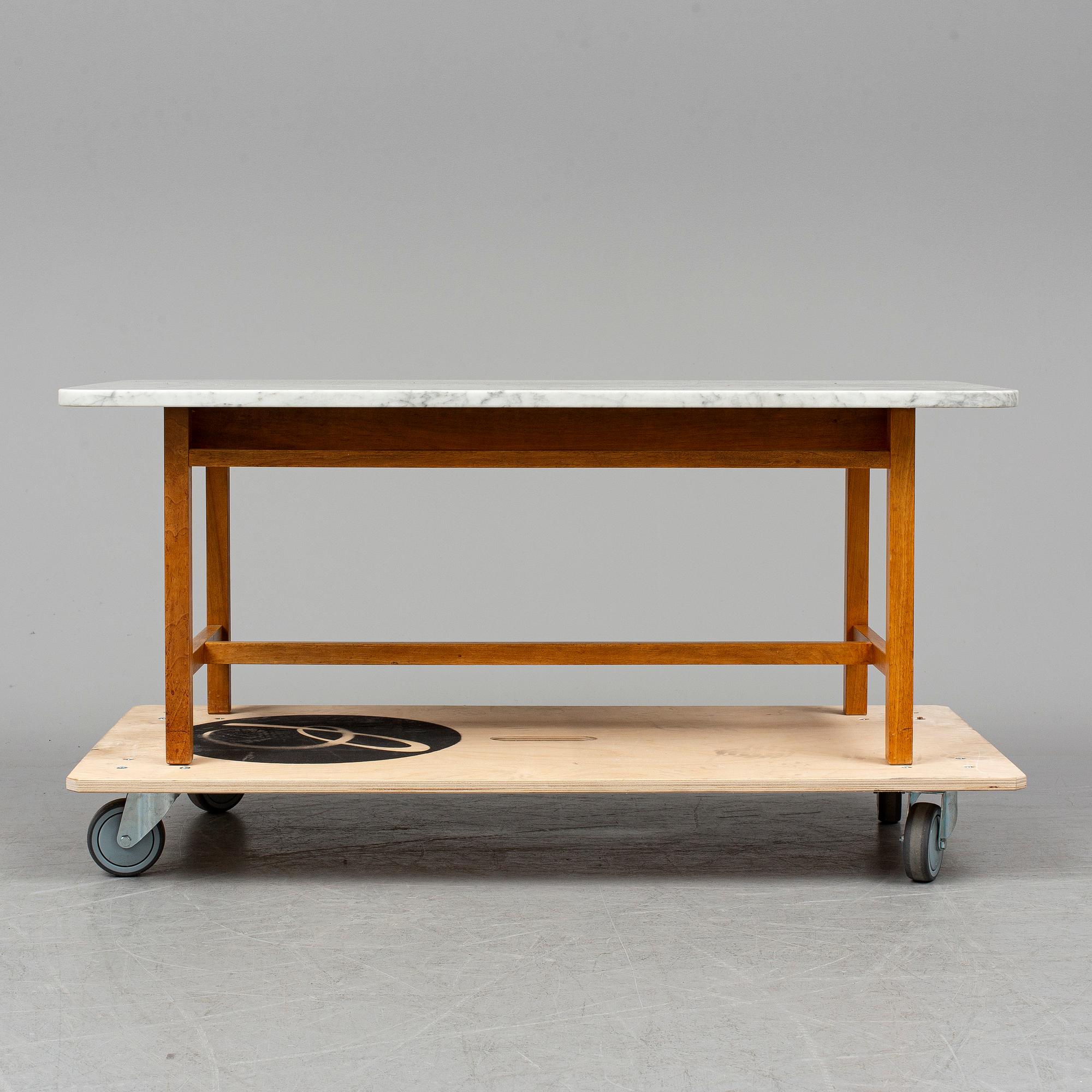 JOSEF FRANK, a model 2125 marble top coffee table from Svenskt Tenn.