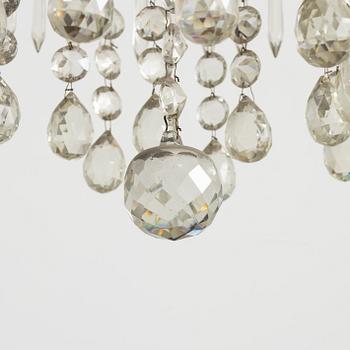 A four-light Gustavian-style chandelier, circa 1900.