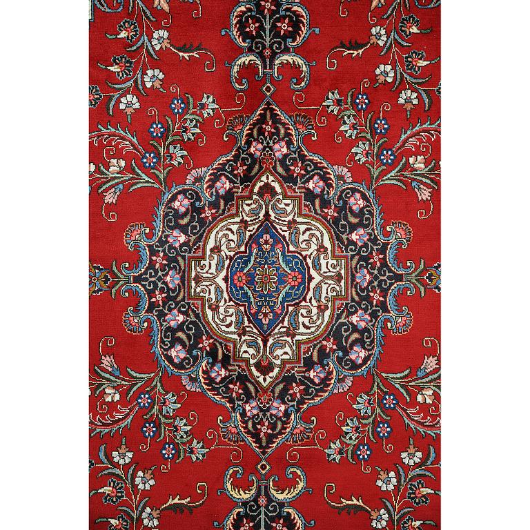 A Tabriz carpet, c 394 x 302 cm.
