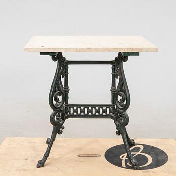 A set of three garden chairs and one cast iron and marble table first half of the 20th century.