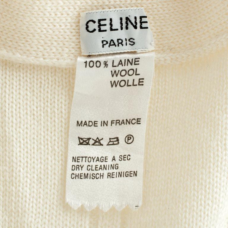 CÉLINE, a white wool cardigan.