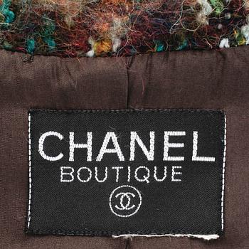CHANEL, a two-piece suit consisting of jacket and skirt.