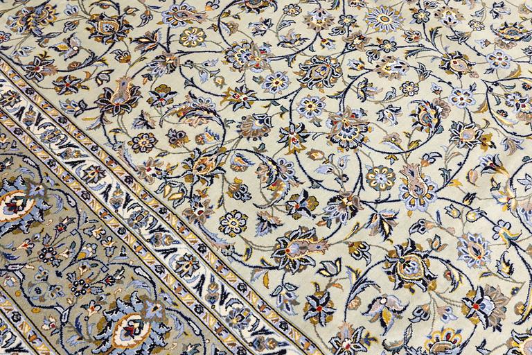 A Keshan carpet, signed, 397 x 302 cm.