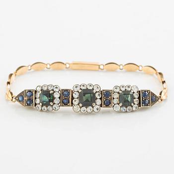 Bracelet low-grade gold with sapphires and white stones.
