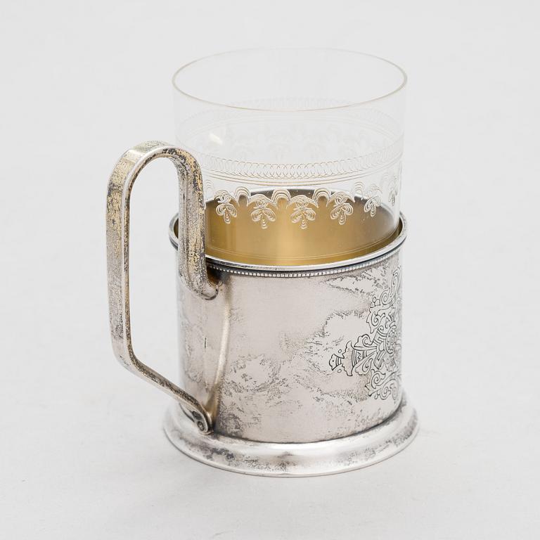 A Russian silver tea glass holder and a tea spoon, Moscow, Alexander Fuld 1889 and Antip Kuzmichev 1888. Glass, Finland.