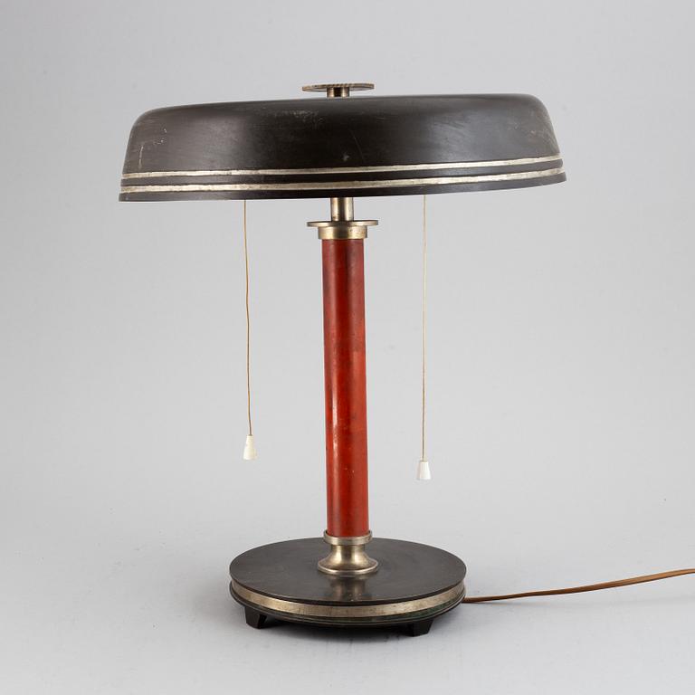 A metal and wood table lamp, first half of the 20th century.