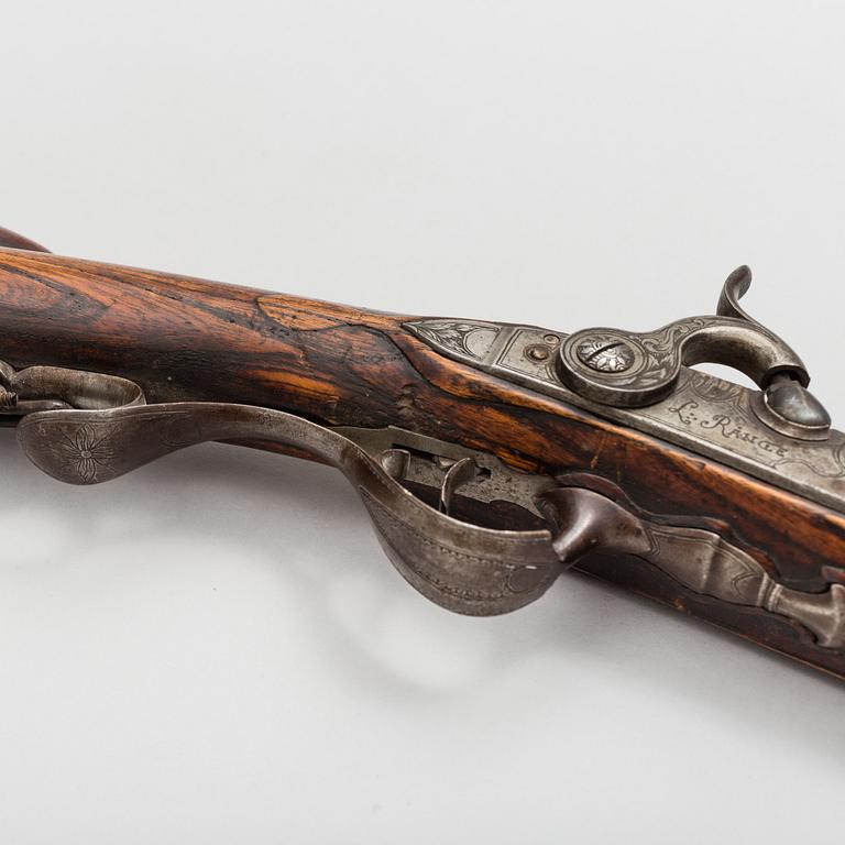 a 18th century rifle later made in to a percussion rifle signed by Lars Rånge, Jönköping.