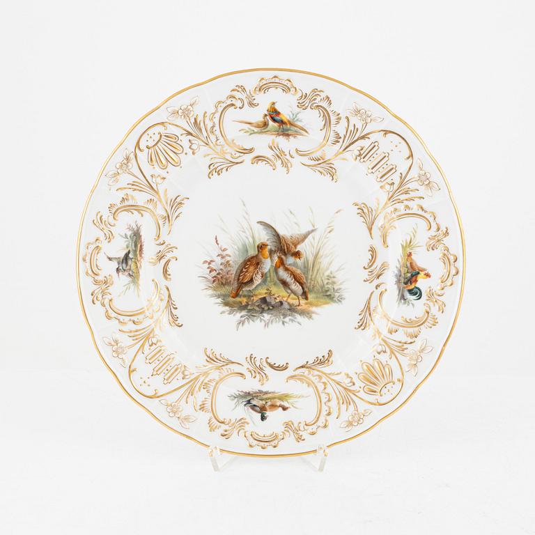 A set of five Meissen porcelain games plates, late 19th to early 20th century.