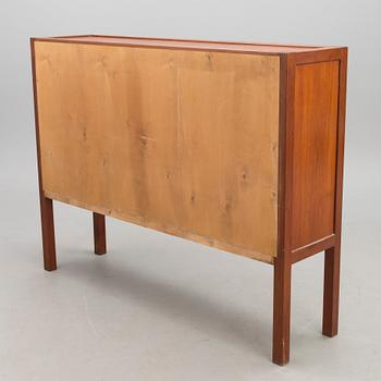 A mid-20th century cupboard 'Näyttely- astiakaappi' for HMN Huonekalu Mikko Nupponen, Lahti, Finland.