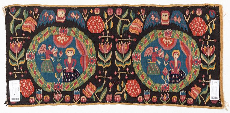 A carrige cushion, 'Bebådelsen (The Annunciation)', tapestry weave, 98 x 45 cm, southwestern Skåne 1801, signed MID.