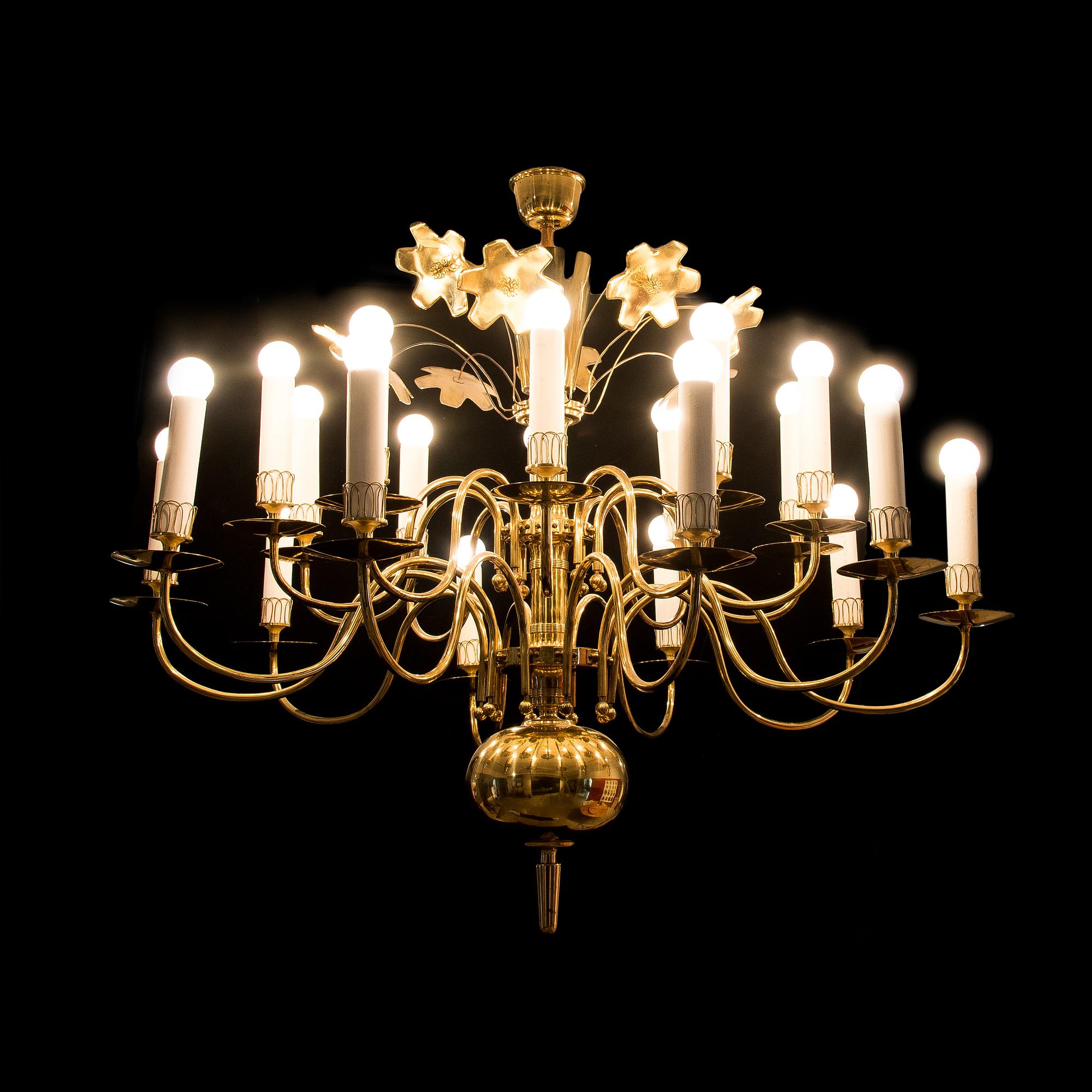 PAAVO TYNELL, A TWENTY-LIGHT CHANDELIER. Manufactured for the old church in Lahti. Taito Oy. 1940s/50s.