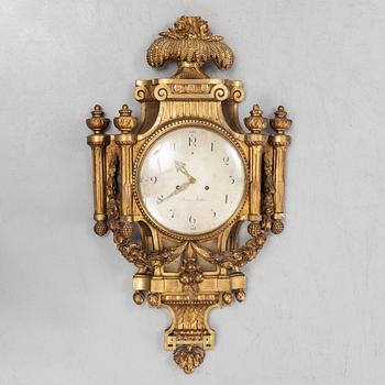 A Gustavian giltwood and parcel-gitl cartel clock by Per Henrik Beurling (Stockholm 1783-1806).