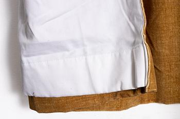 A pair of yellow velvet curtains from Brochier Como.