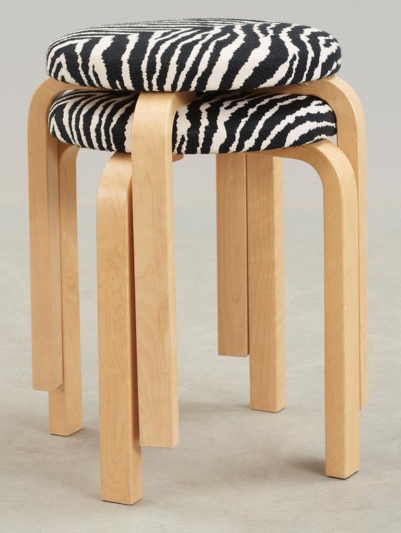 A pair of Alvar Aalto stools for Artek, Finland 2002.