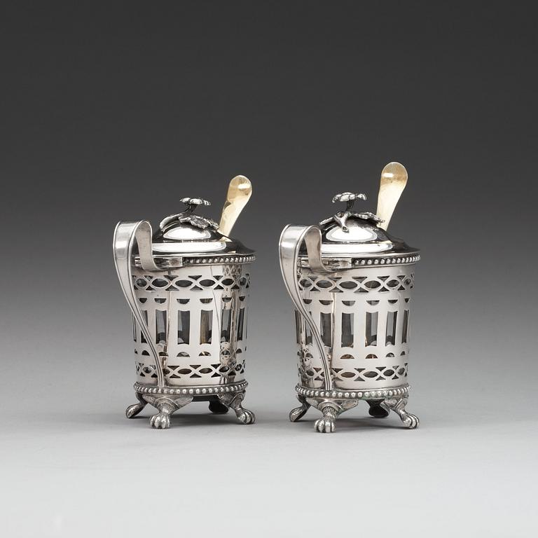 A pair of Swedish 18th century silver mustard-pots and spoons, makers mark of Simson Ryberg, Stockholm 1794.