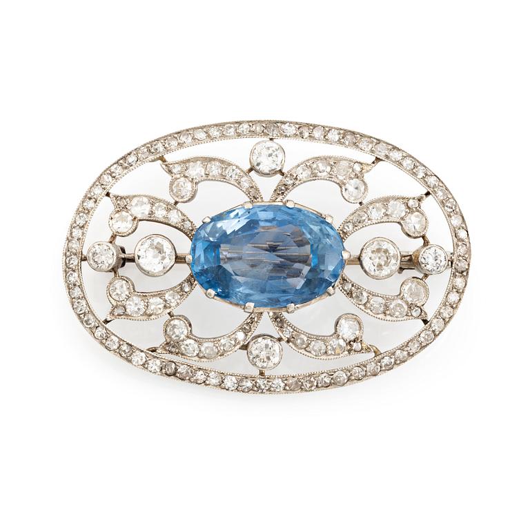 A WA Bolin brooch in platinum set with a faceted sapphire and old- and eight-cut diamonds.