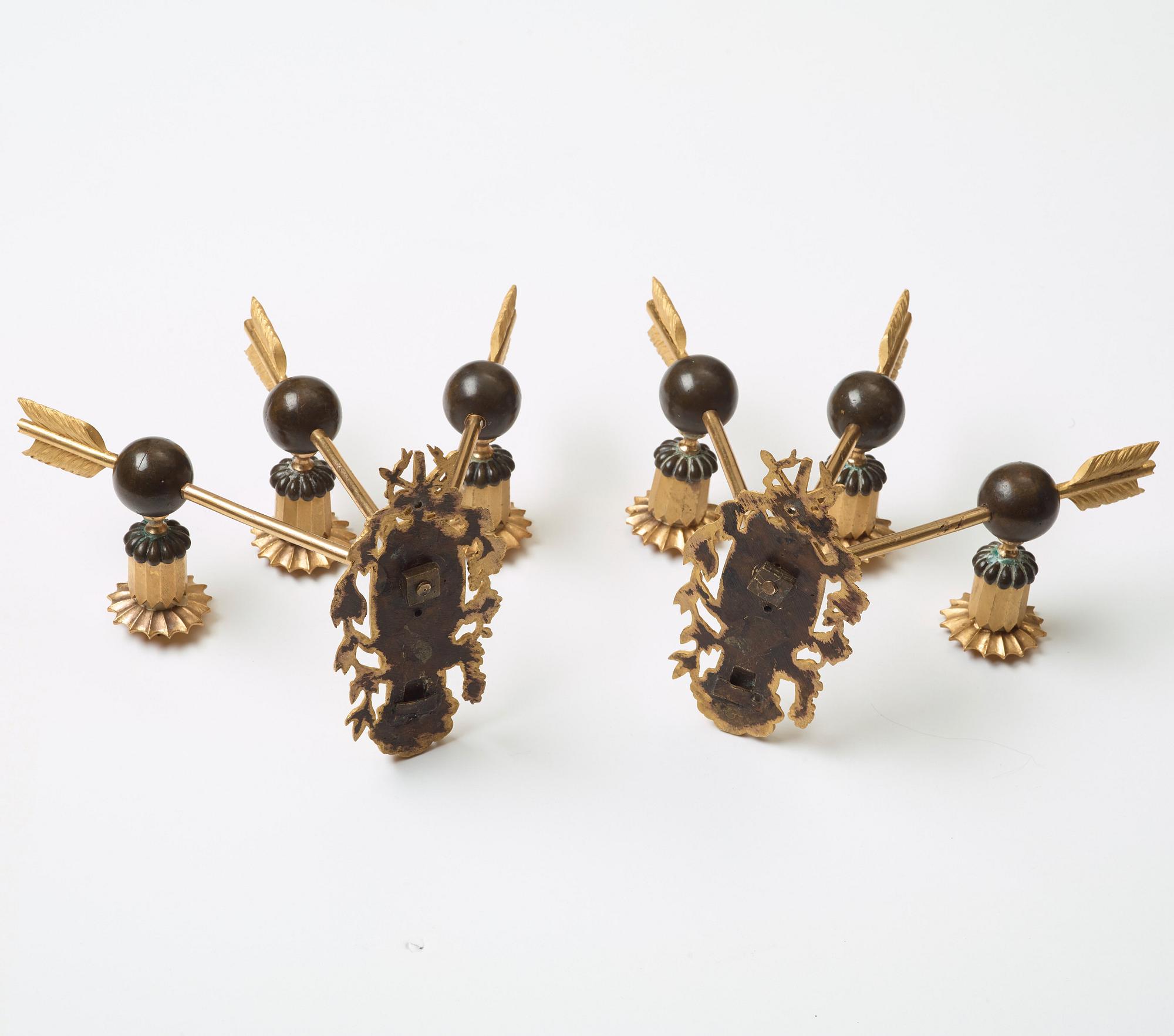 A pair of Empire three-light wall-lights, early 19th century Stockholm or St Petersburg.