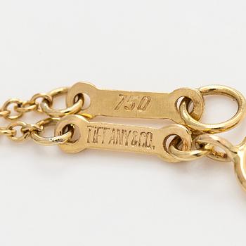 Tiffany & Co, Elsa Peretti, an 18K gold "Open Heart" necklace.