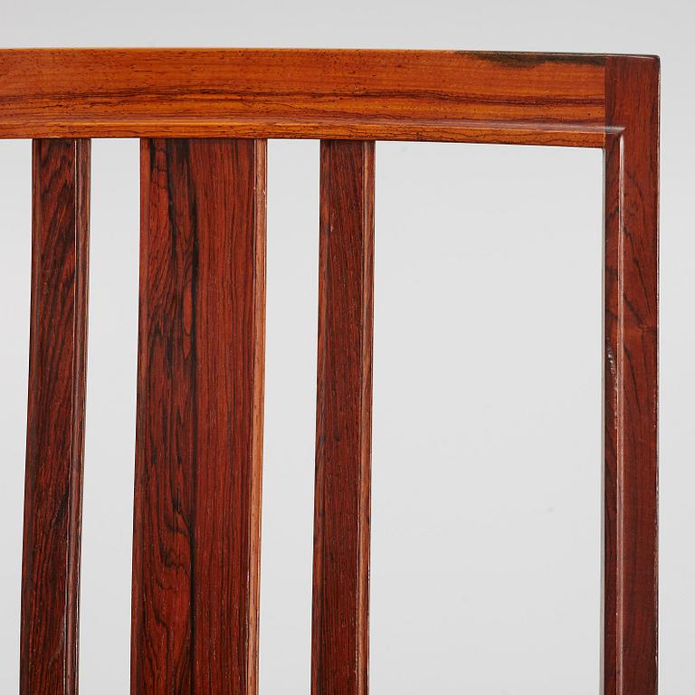 Bertil Fridhagen, a rosewood-veneered dining table with four chairs, BOdsfors, Sweden, 1960's.