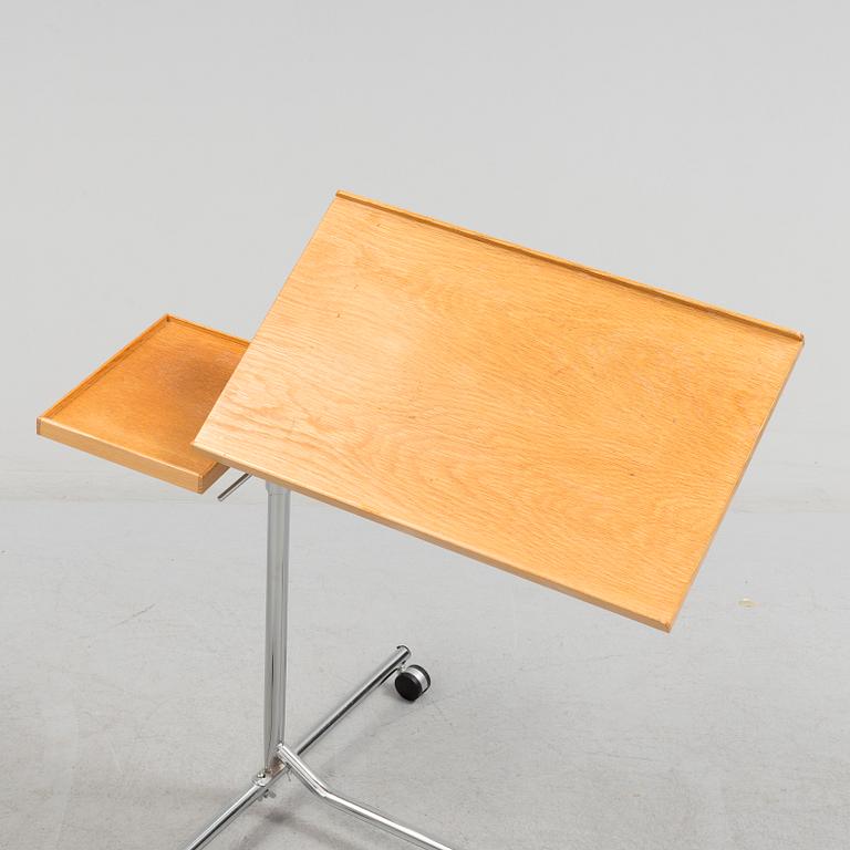 A teak reading table, second half of the 20th Century.