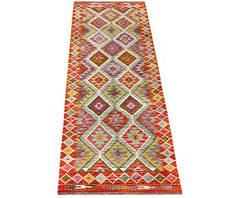 A Kilim runner carpet, c. 291 x 80 cm.