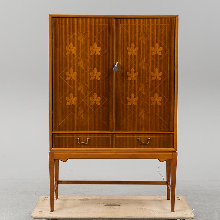A mid 20th Century bar cabinet.