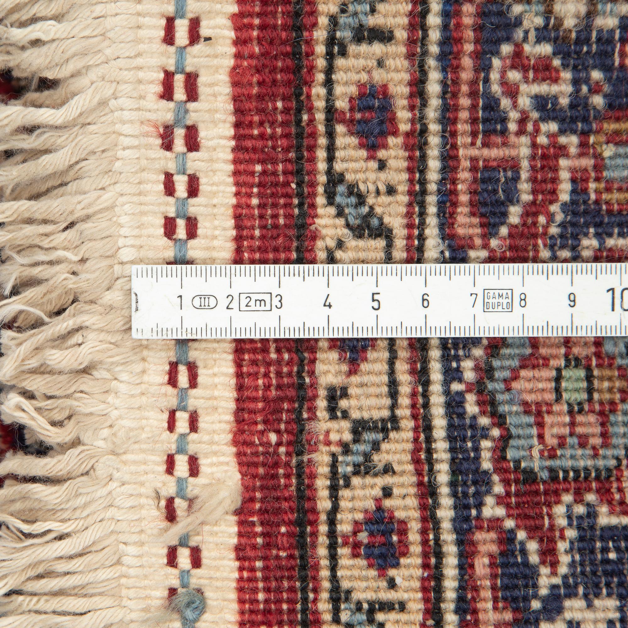 A runner, Tabriz probably, signed, ca 193 x 70 cm.
