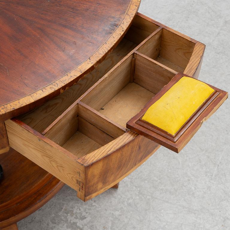 An Empire sewing table, mid-19th Century.