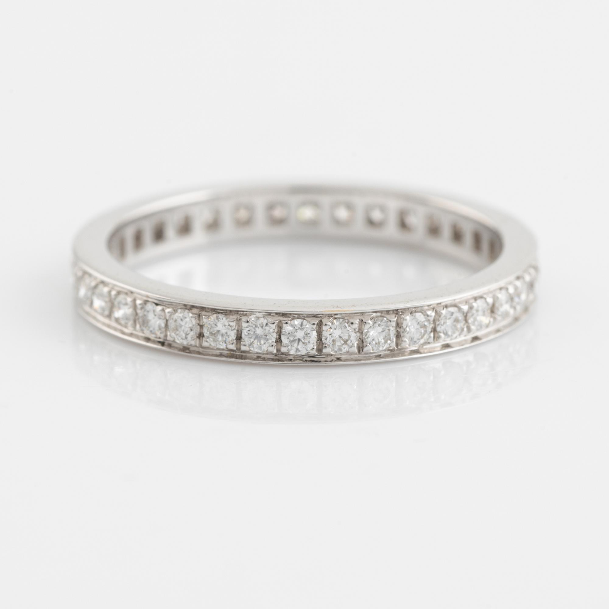 Brilliant cut diamond eternity ring.