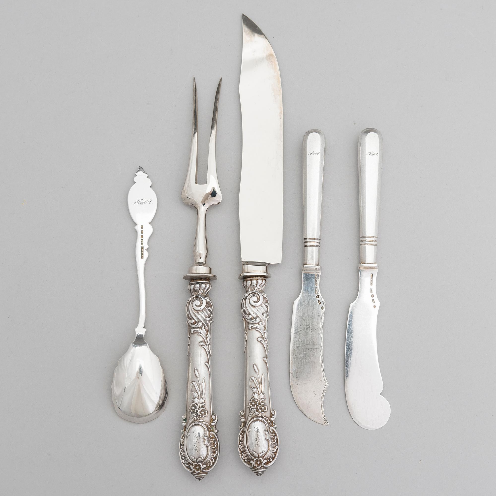 Silver serving cutlery, three with mark of Ferdinand Timper, Helsinki 1901-02 and a pair with German marks, ca. 1900.