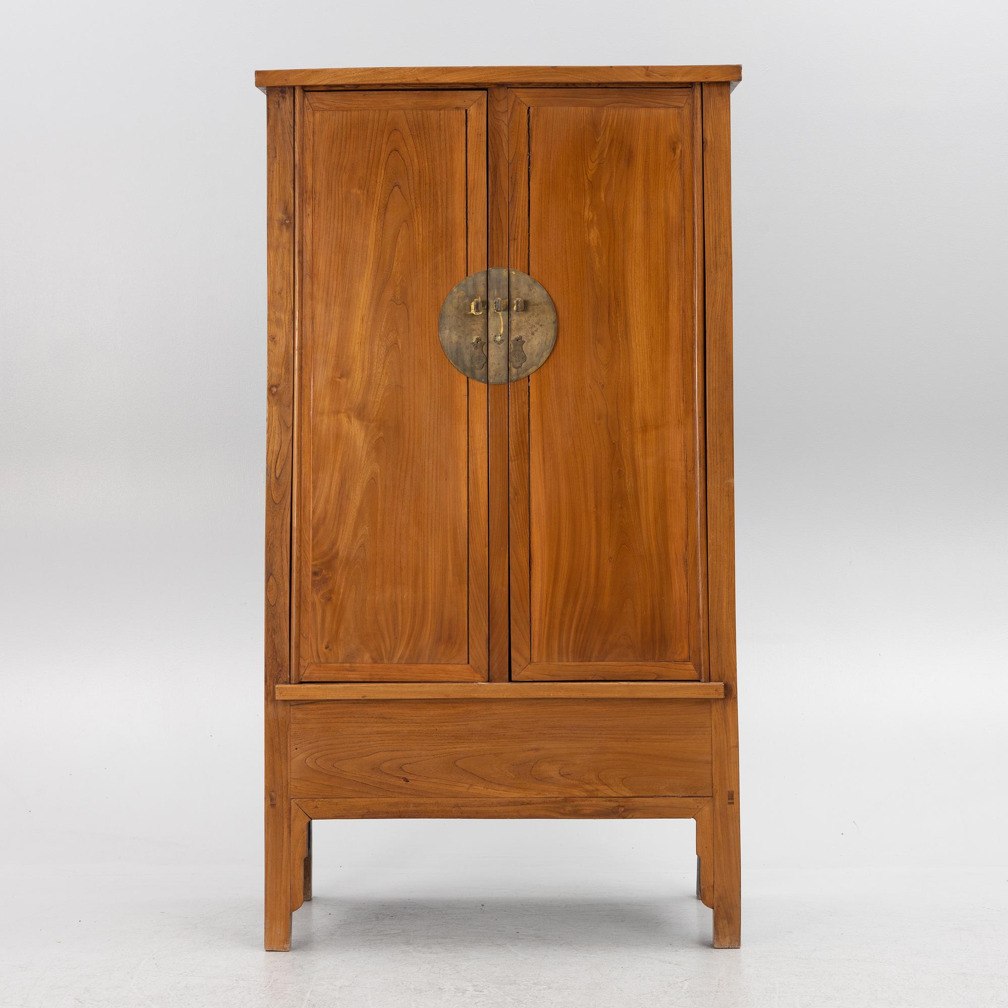 A Chinese hardwood cabinet, 20th century.
