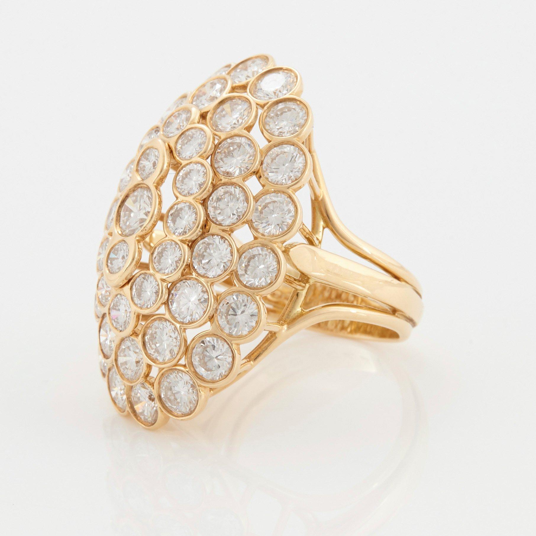 Cartier a ring in 18K gold set with round brilliant-cut diamonds.