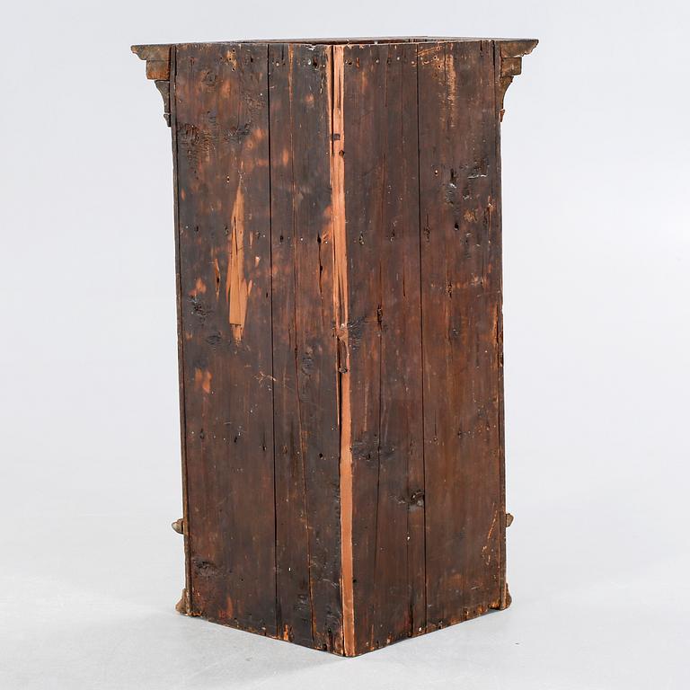 A 18th century corner cabinet.