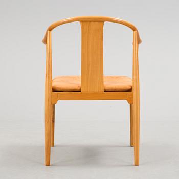 A Hans J Wegner 'Kinastolen' armchair, Fritz Hansen, Denmark 1971.