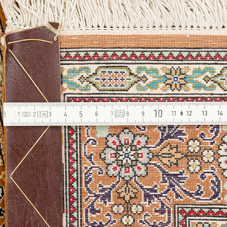 A carpet, oriental silk, circa 145 x 97 cm.