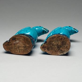 A pair of turquoise and aubergine glazed parrots, Qing dynasty, 19th Century.