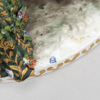 A rokoko style porcelain figurine group, Europe, early 20th century.