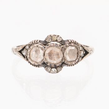 An 18K white gold ring set with rose cut diamonds.