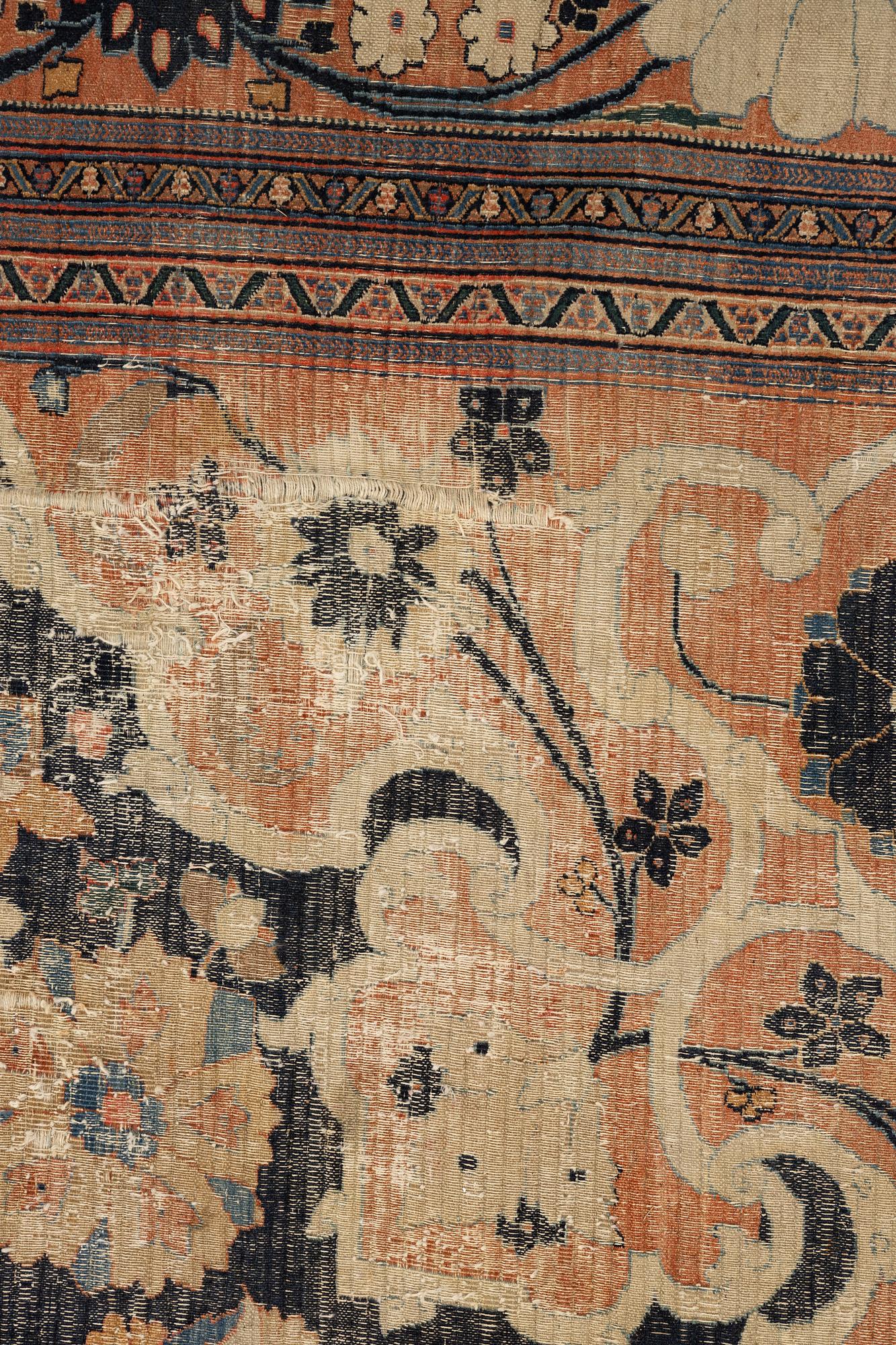 An antique Persian Doroshk carpet, signed, ca 475 x 397 cm.